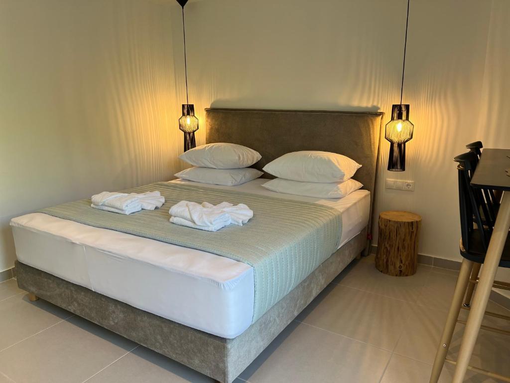 Postel nebo postele na pokoji v ubytování Likno Hotel