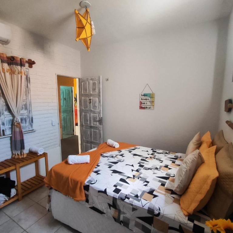 Postel nebo postele na pokoji v ubytování Hospedaria Mandacaru