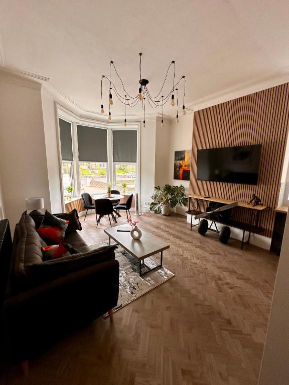 a living room with a couch and a table at No1,luxury 1 bed apartment in Saint Annes on the Sea