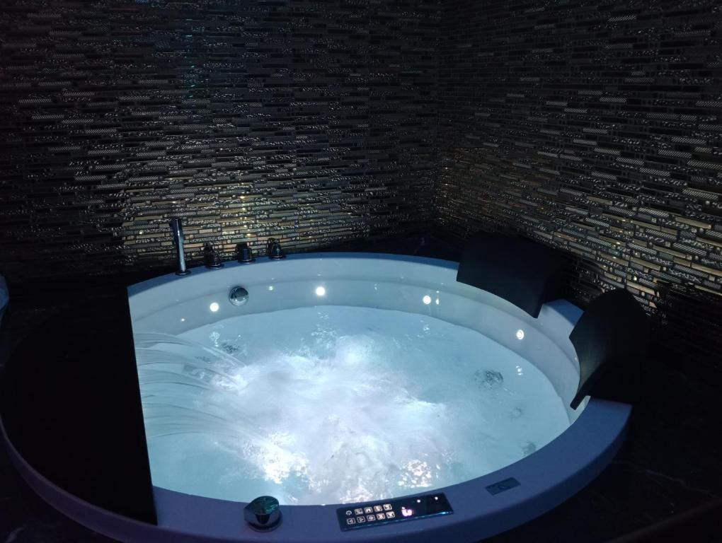 a bathroom with a jacuzzi tub in a room at Il vecchio sentiero in Acireale