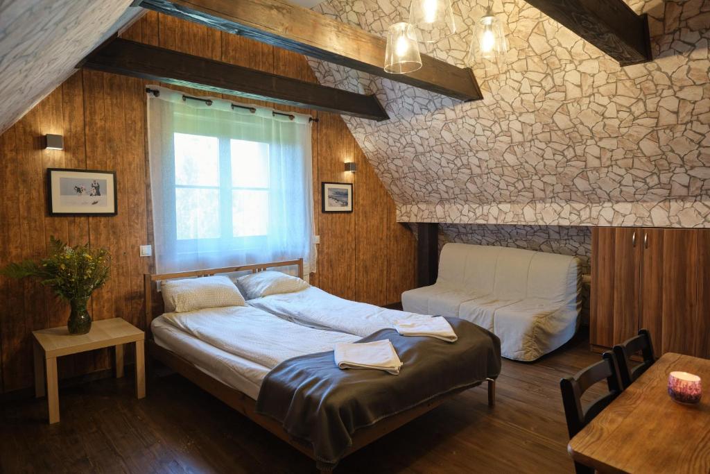 Postel nebo postele na pokoji v ubytování Villa Biesisko Przysłup Cisna