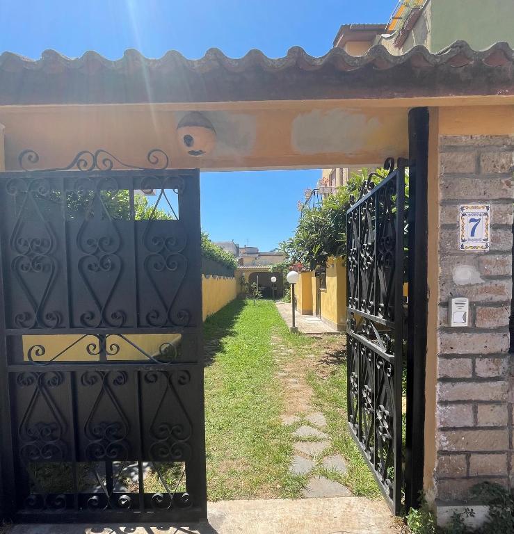 an entrance to a house with an iron gate at Villino indipendente Stella in Anzio
