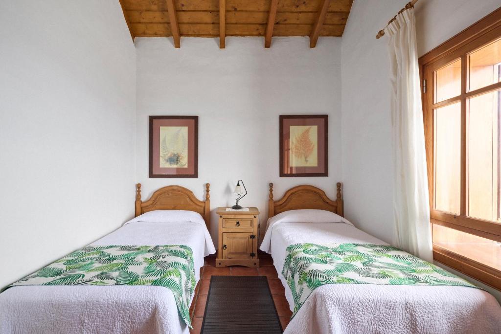 Postel nebo postele na pokoji v ubytování Casas Rurales Los Almendreros