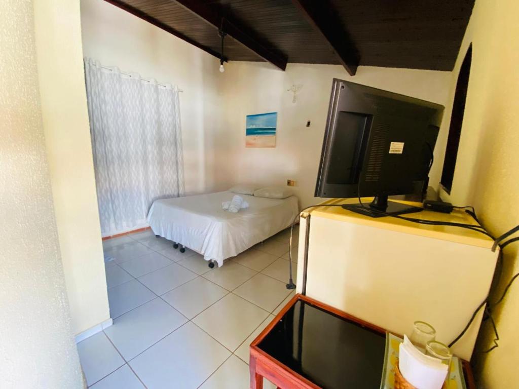 Postel nebo postele na pokoji v ubytování Pousada Tropicalia