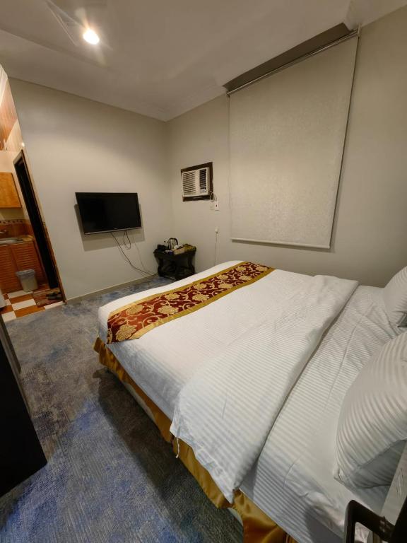 Postel nebo postele na pokoji v ubytování Elaf HotelSuits