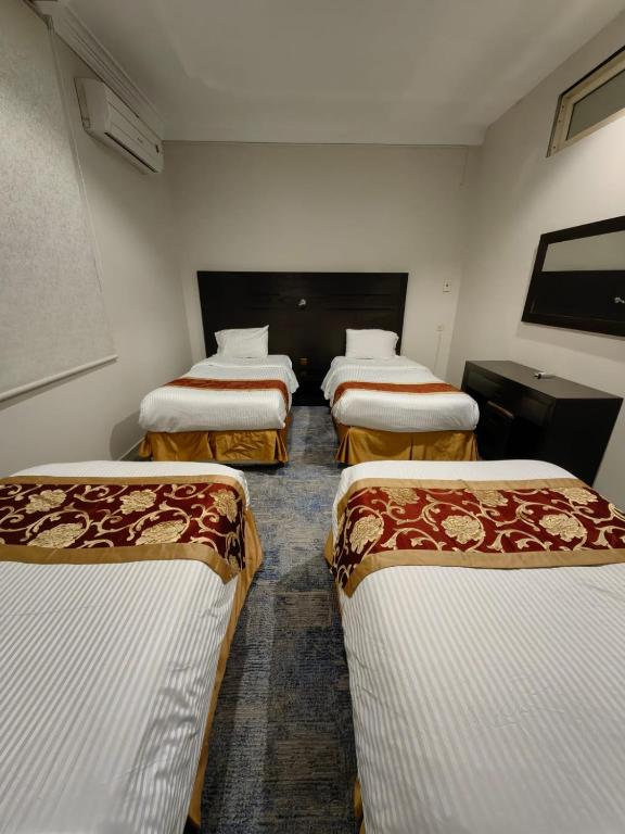 Postel nebo postele na pokoji v ubytování Elaf HotelSuits