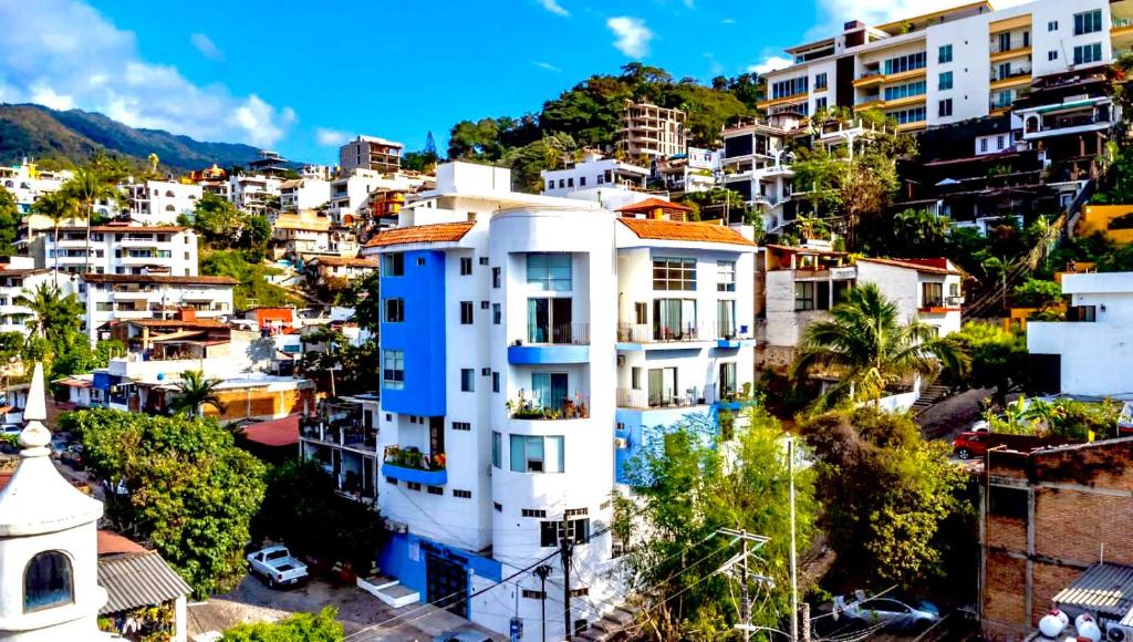 a view of a city with white buildings at Just Beachy PV in Puerto Vallarta