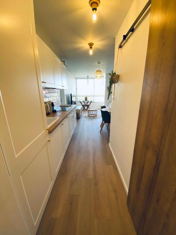 Kuchyň nebo kuchyňský kout v ubytování Appartement cosy
