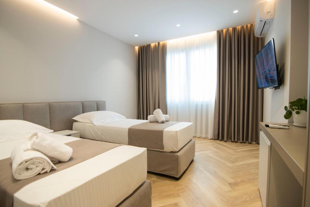 Postel nebo postele na pokoji v ubytování Mina Luxury Rooms