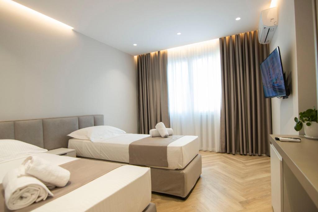 Postel nebo postele na pokoji v ubytování Mina Luxury Rooms