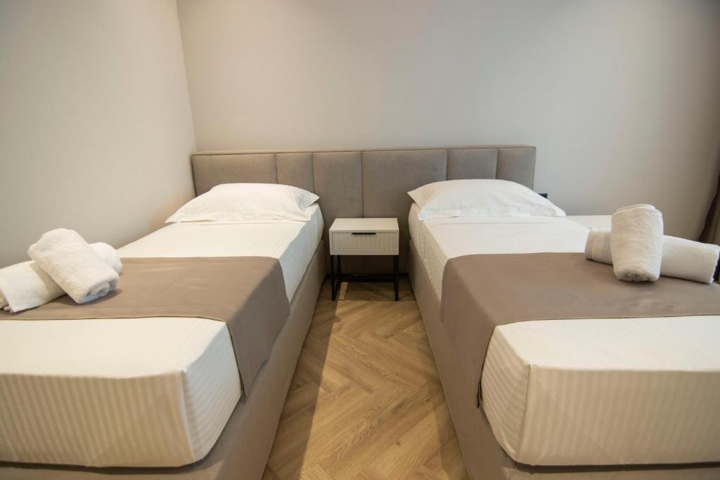 Postel nebo postele na pokoji v ubytování Mina Luxury Rooms