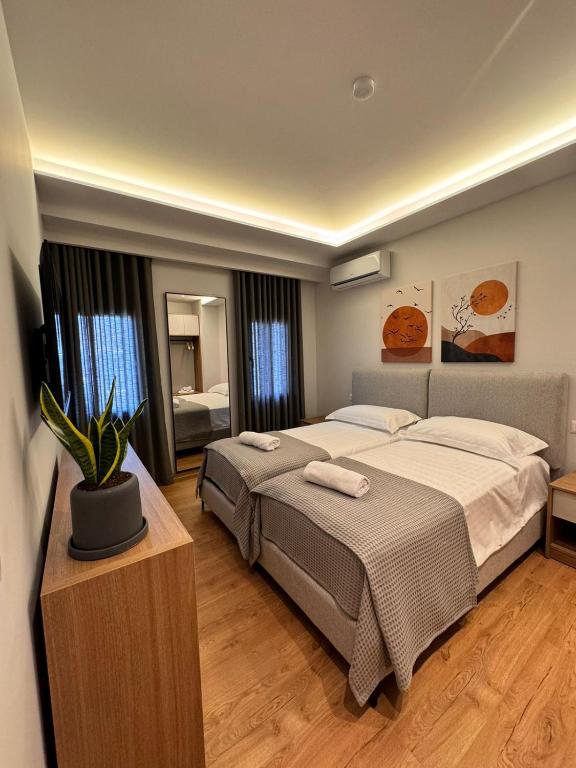 Postel nebo postele na pokoji v ubytování Izi Boutique