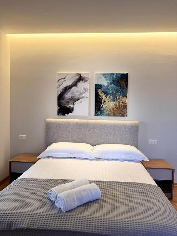 Postel nebo postele na pokoji v ubytování Izi Boutique