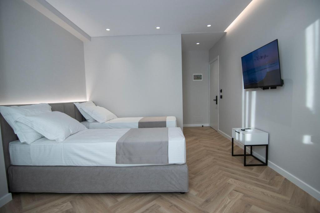 Postel nebo postele na pokoji v ubytování Mina Luxury Rooms