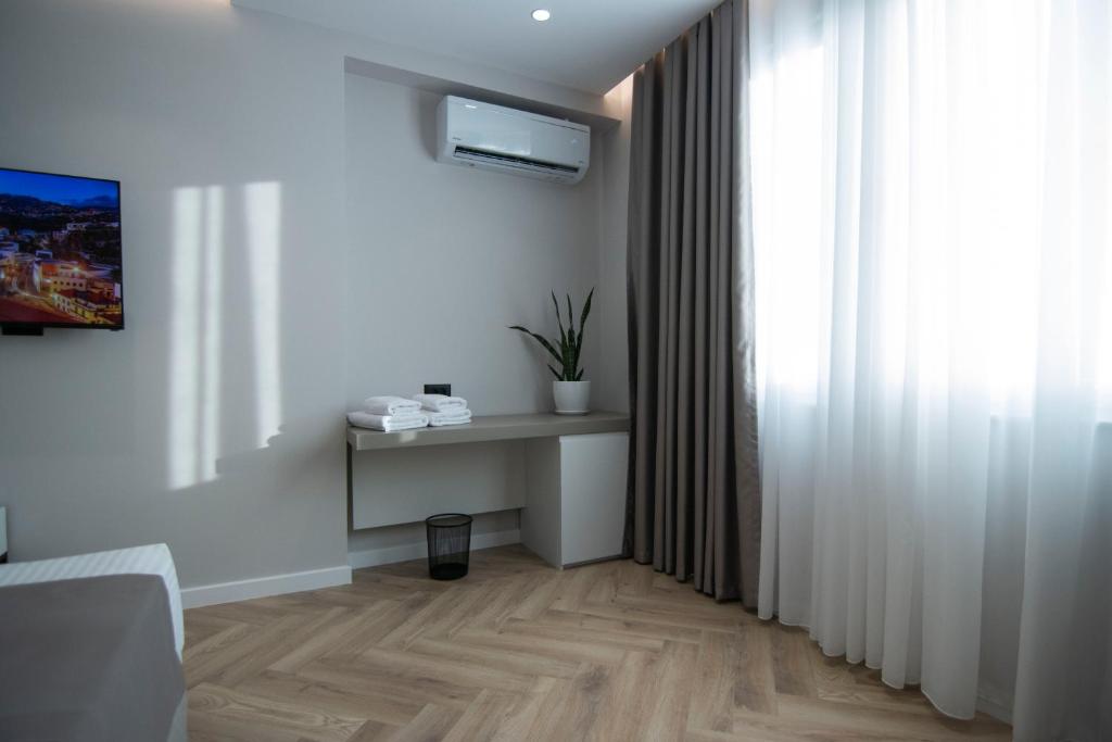 TV a/nebo společenská místnost v ubytování Mina Luxury Rooms