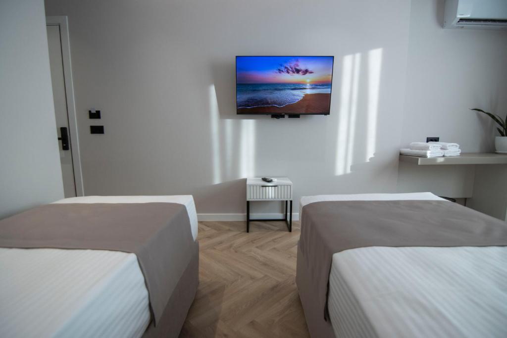 Postel nebo postele na pokoji v ubytování Mina Luxury Rooms