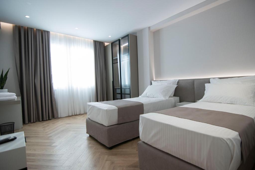 Postel nebo postele na pokoji v ubytování Mina Luxury Rooms