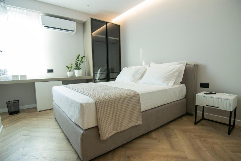 Postel nebo postele na pokoji v ubytování Mina Luxury Rooms
