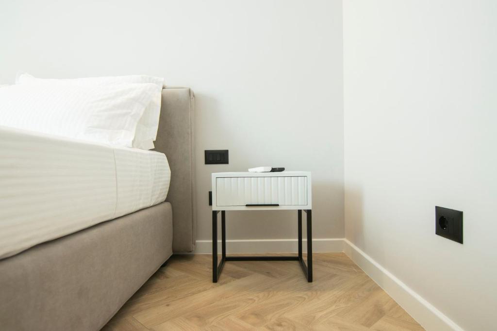 Postel nebo postele na pokoji v ubytování Mina Luxury Rooms