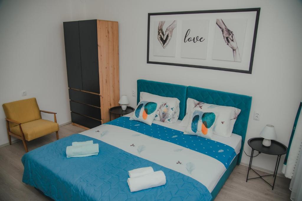 Postel nebo postele na pokoji v ubytování Jes Apartments