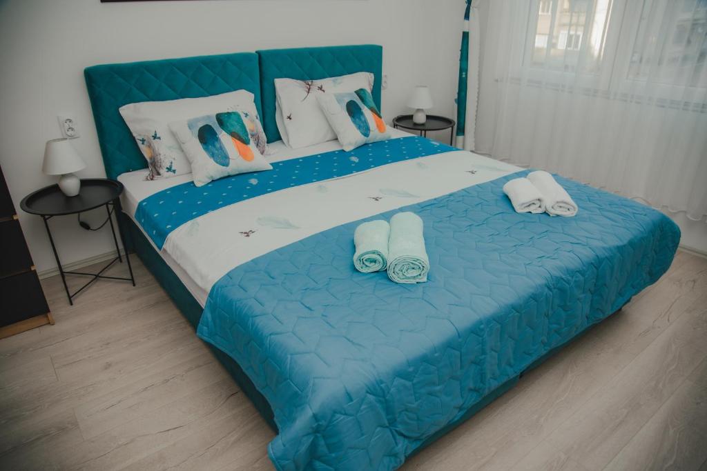 Postel nebo postele na pokoji v ubytování Jes Apartments