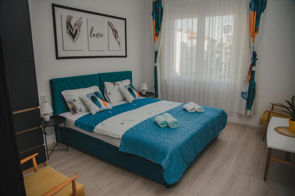 Postel nebo postele na pokoji v ubytování Jes Apartments