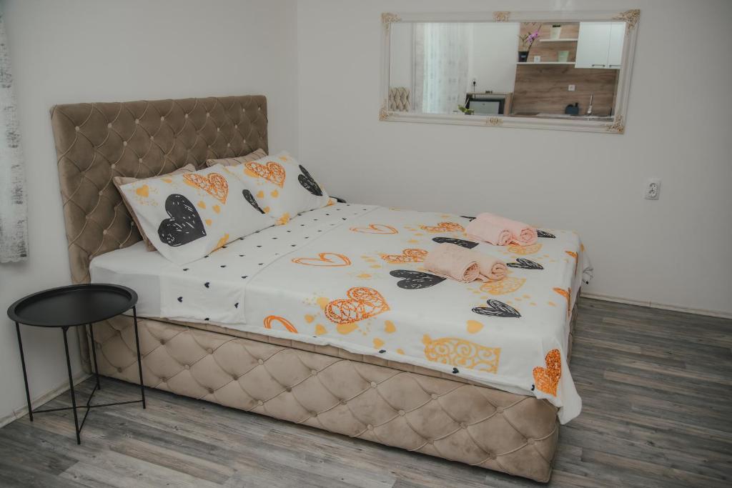 Postel nebo postele na pokoji v ubytování Jes Apartments