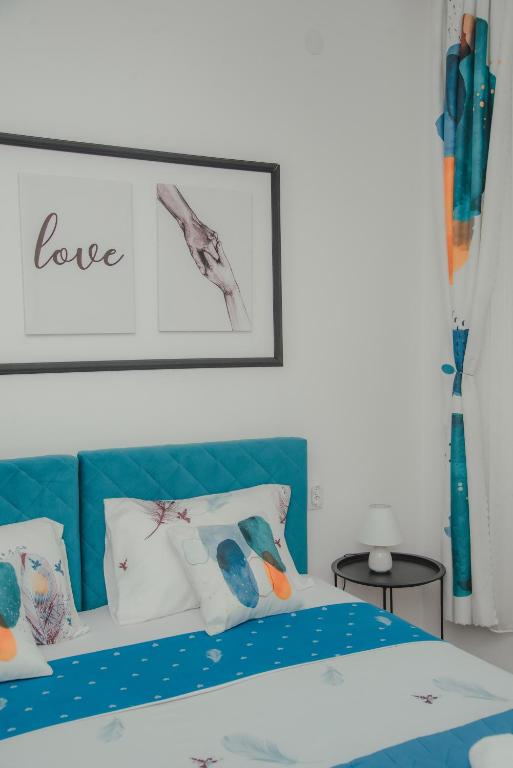 Postel nebo postele na pokoji v ubytování Jes Apartments