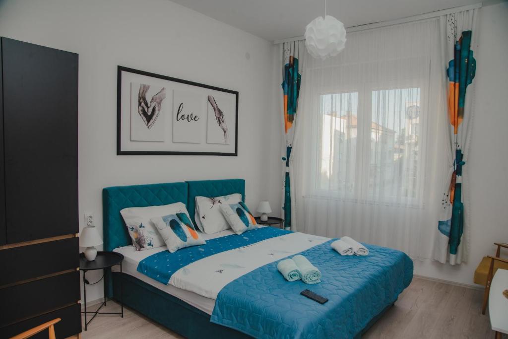 Postel nebo postele na pokoji v ubytování Jes Apartments