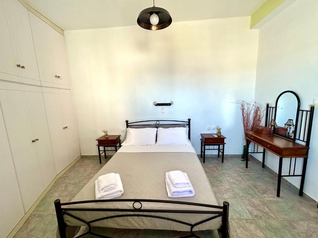 Postel nebo postele na pokoji v ubytování Eutopia House