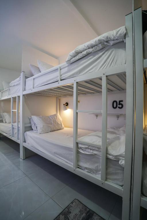 a couple of bunk beds in a room at Putih Hostel in Klang