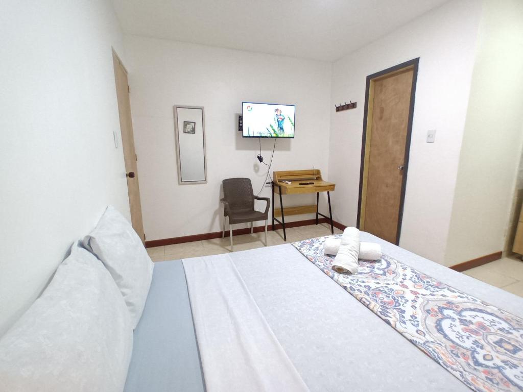 Confortable y Central Habitacion cerca a la Playa Spratt Bight y Malecon - 带私人浴室的双人间