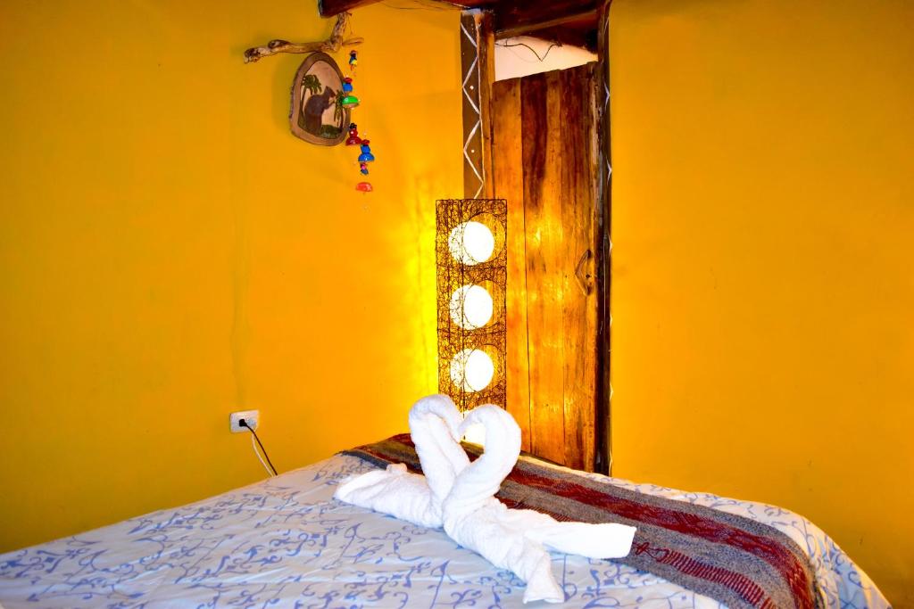 Voodi või voodid majutusasutuse Salkantay Hostel Chaullay toas