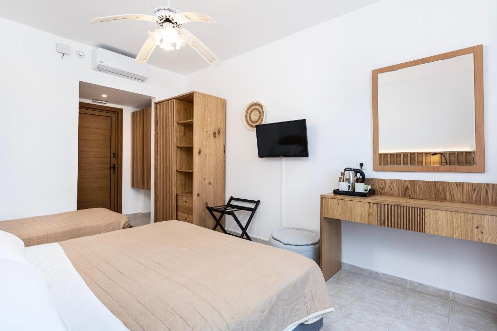 Postel nebo postele na pokoji v ubytování Aegean Bay Hotel
