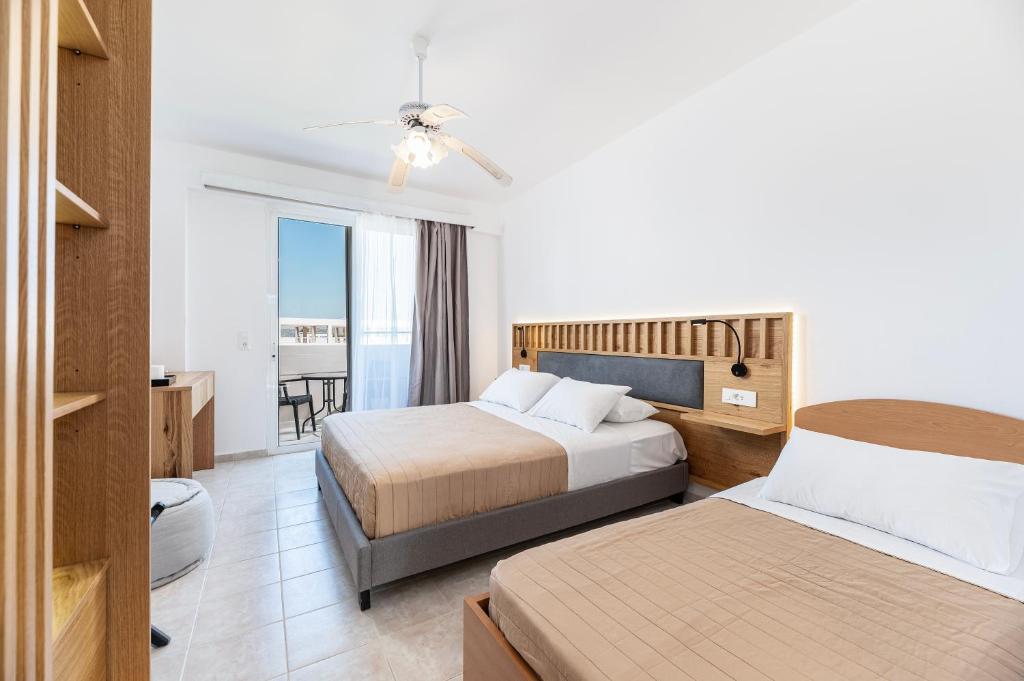 Postel nebo postele na pokoji v ubytování Aegean Bay Hotel