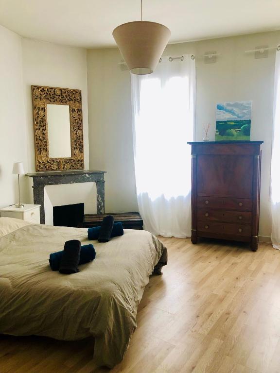 Un ou plusieurs lits dans un hébergement de l'établissement Maison de ville au Cœur d'Angoulême- 2 chambres-Wifi- Cosy - Idéal de 1 à 6 Personnes - conciergerie J&N