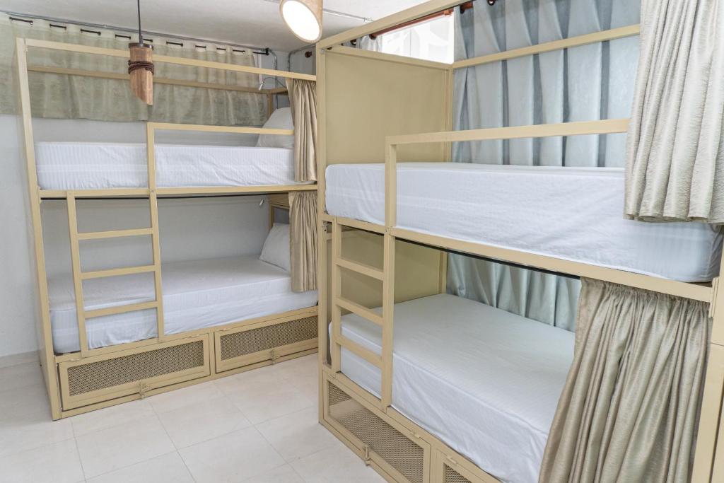 Postel nebo postele na pokoji v ubytování Hostal Las Guaduas