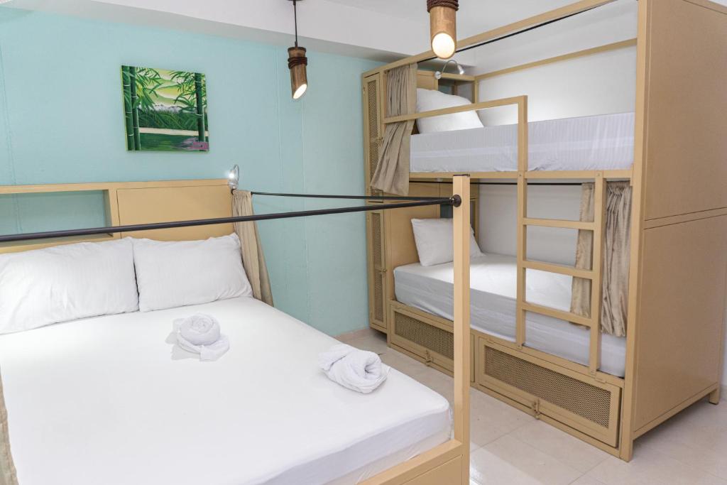 Postel nebo postele na pokoji v ubytování Hostal Las Guaduas