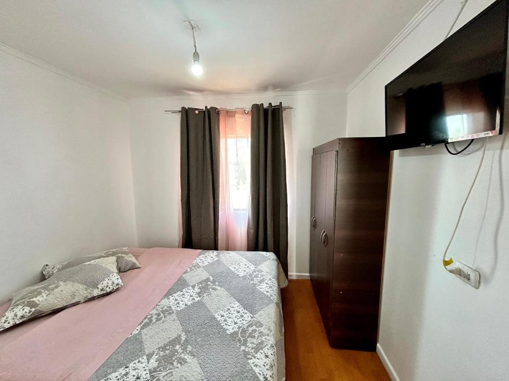 Ένα ή περισσότερα κρεβάτια σε δωμάτιο στο Hostal la Plaza