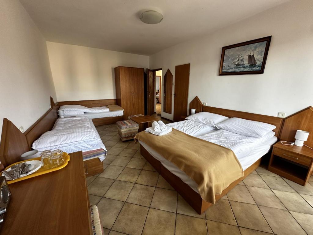 Postel nebo postele na pokoji v ubytování Ramzes 2