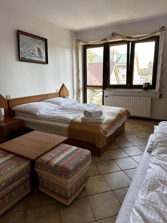 Postel nebo postele na pokoji v ubytování Ramzes 2
