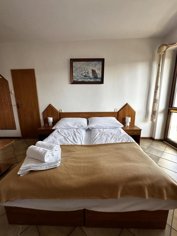 Postel nebo postele na pokoji v ubytování Ramzes 2