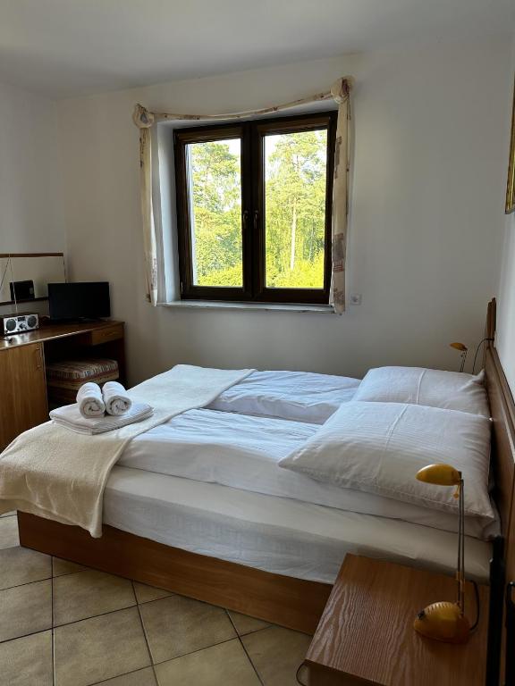 Postel nebo postele na pokoji v ubytování Ramzes 2