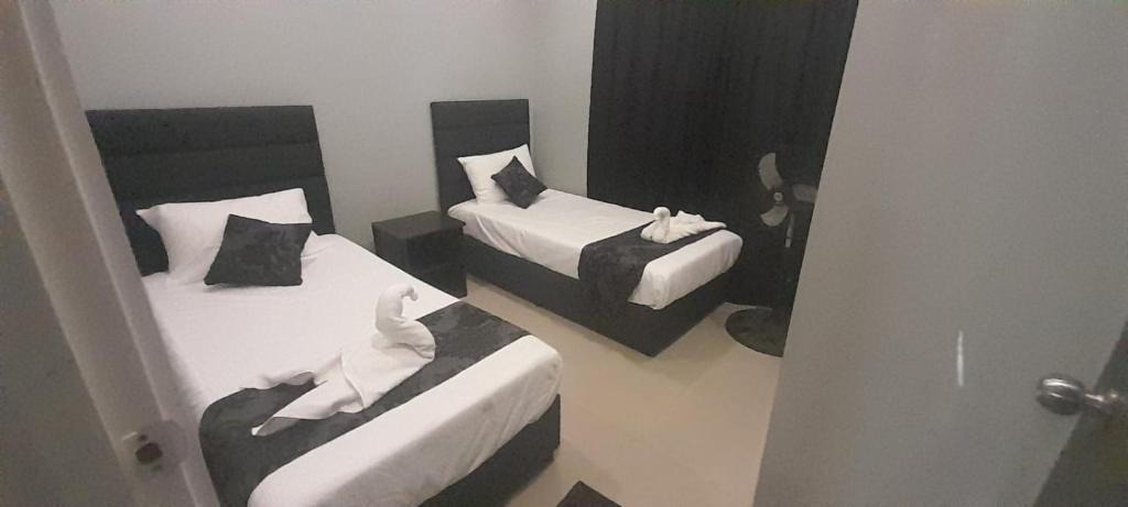 Postel nebo postele na pokoji v ubytování Prasad Apartments