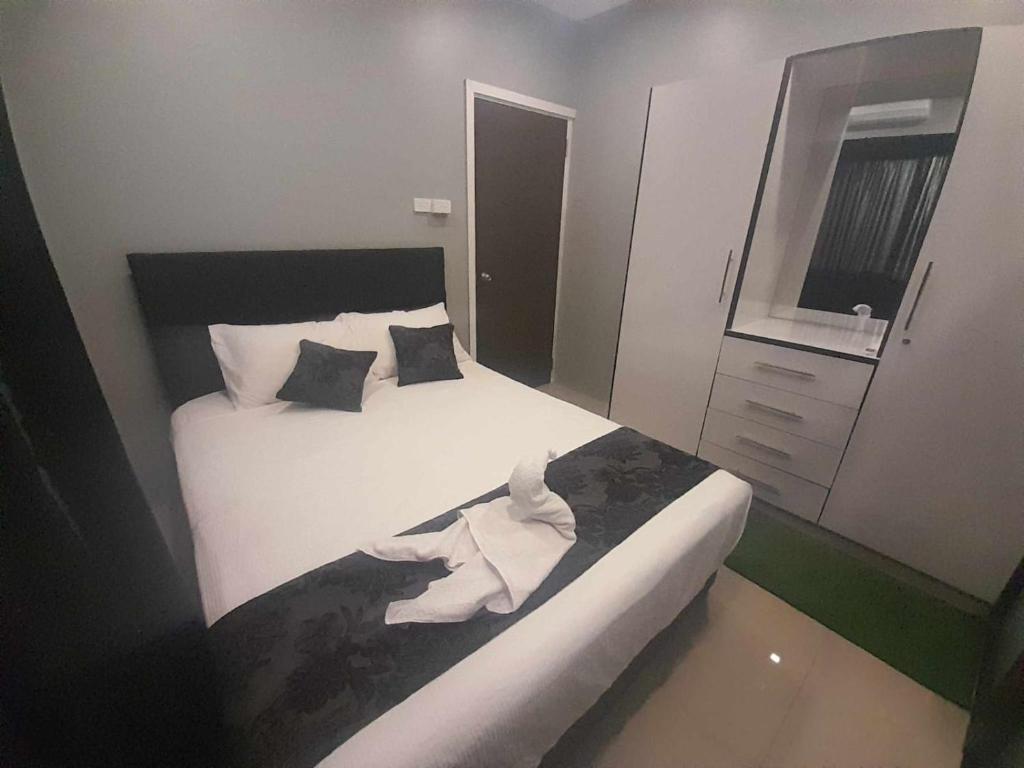 Postel nebo postele na pokoji v ubytování Prasad Apartments