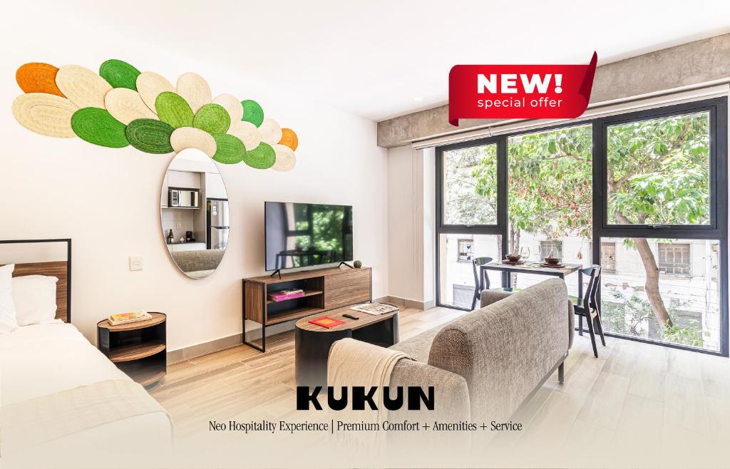 a living room with a bed and a tv at Kukun Reforma & Downtown in Mexico City