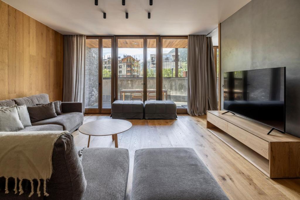 TV a/nebo společenská místnost v ubytování Un diamante de montaña l A Pie De Pistas De Esquí - Gimnasio - Sauna - Piscina l 8Pax l by BonesVacances