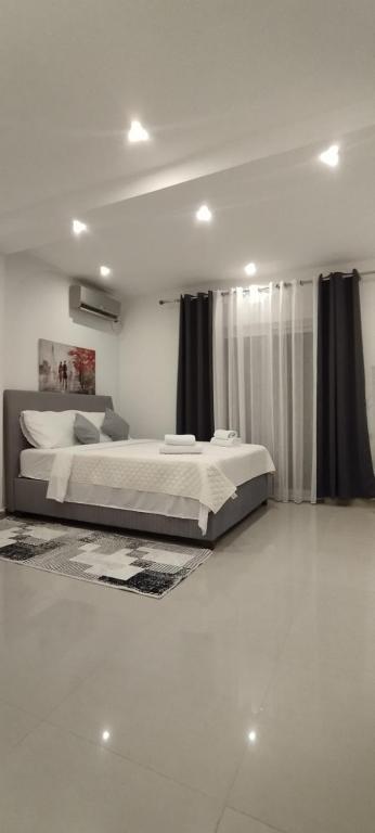 Postel nebo postele na pokoji v ubytování Kahari Apartments