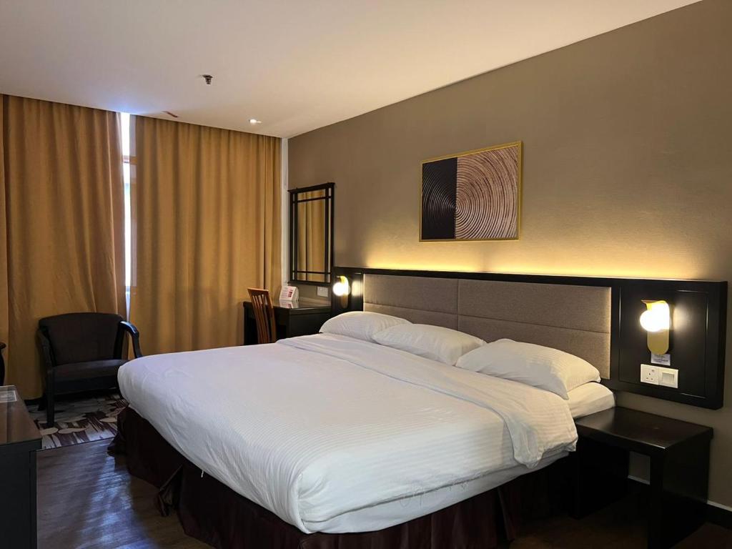 Postel nebo postele na pokoji v ubytování Remington Hotel