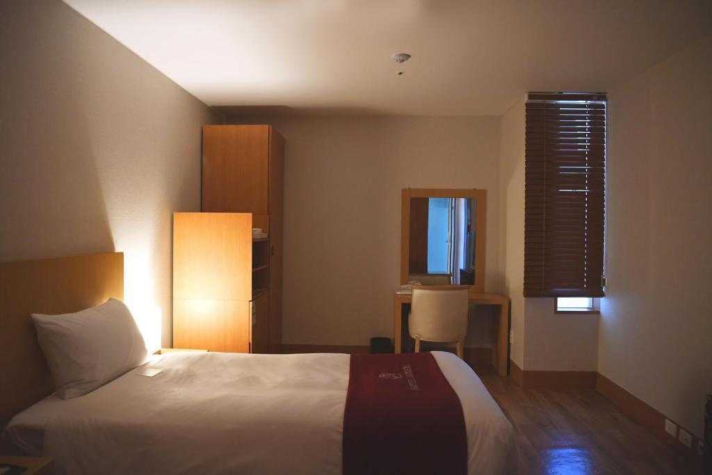 Postel nebo postele na pokoji v ubytování Hotel Laonzena